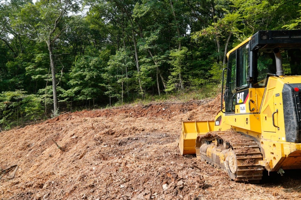 The bank cut into the hillside just in front of the track loader is the approximate location of the 400 yard target line. (08/22/18)