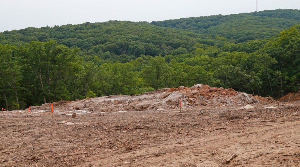 Hillside area after the blasting was done on Thursday August 23rd. Rock and soil moved down the hill. (08/23/18)